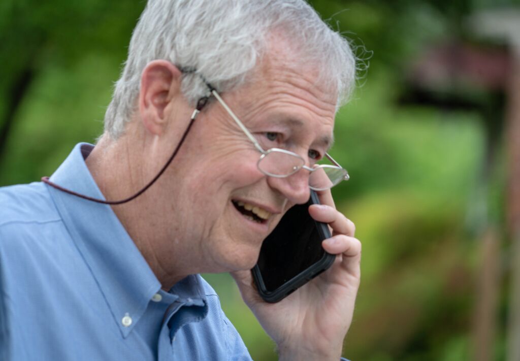 Hal Harris talking to client